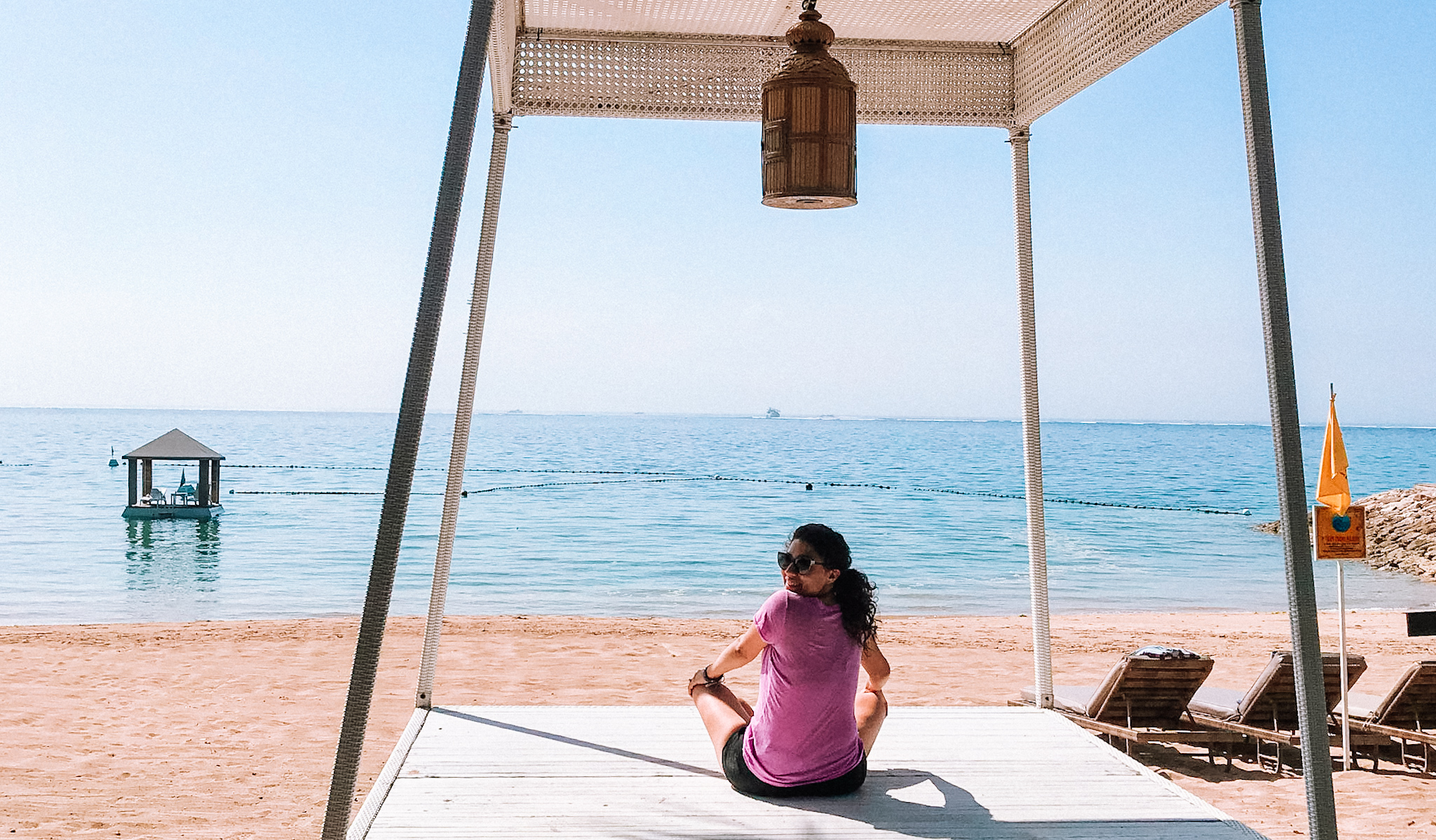 girl in bali meditated by the ocean